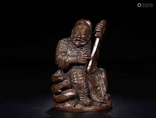 A BAMBOO SITTING FIGURE ORNAMENT