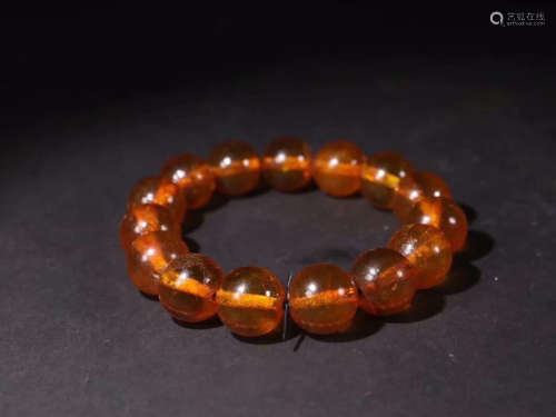 A BRACELET MADE OF AMBER BEADS