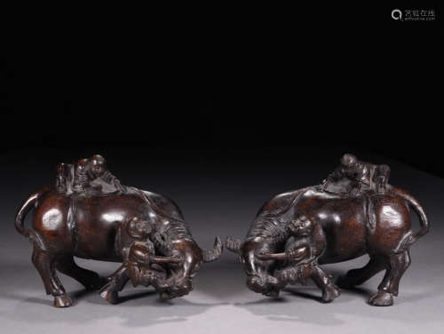 A PAIR OF CHENXIANG WOOD BULL&FIGURE ORNAMENTS