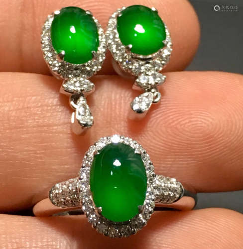A PAIR OF GREEN JADEITE EARRINGS AND A GREEN JADEITE RING