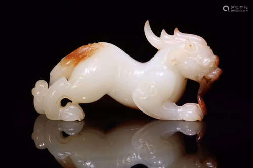 A HETIAN JADE ORNAMENT OF ONE HORN BEAST