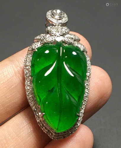 A GREEN JADEITE PENDANT OF TREE LEAF