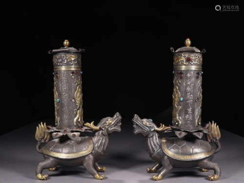 A PAIR OF GILT SILVER HOLDERS WITH BEAST BASE