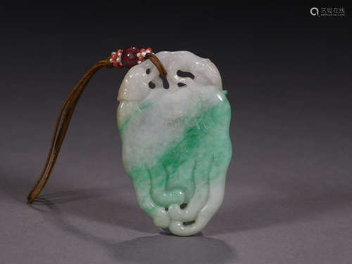 A JADEITE PENDANT OF BERGAMOT SHAPED