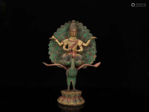 A BRONZE BUDDHA FIGURE WITH PAINTED PEACOCK-LIKE FEATHERS