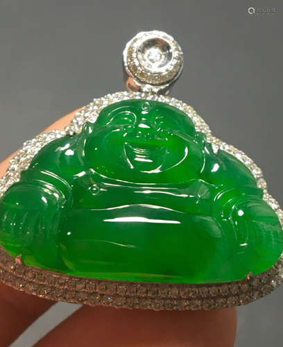 A GREEN JADEITE PENDANT OF BUDDHA