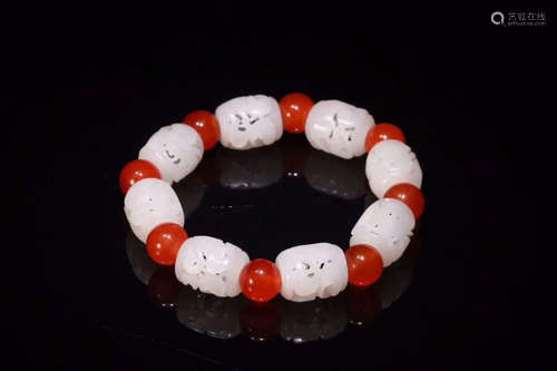 A BRACELET MADE OF EIGHT HETIAN JADE BEADS