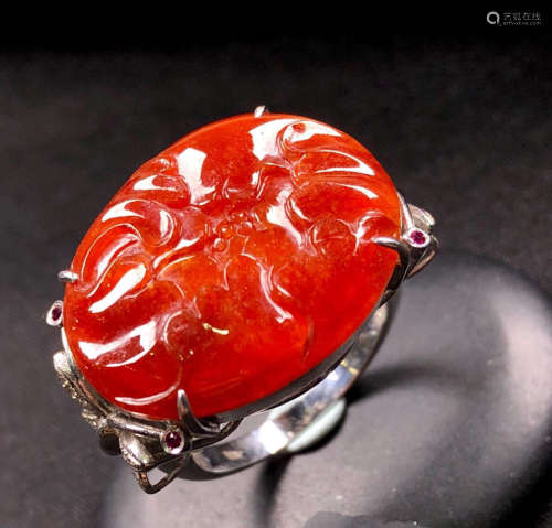A RED JADEITE RING OF BLOSSOMING FORTUNE FLOWER