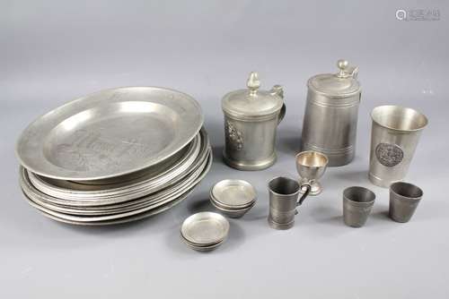 Early 20th Century Continental Pewter, this lot includes lidded tankard, six plates, decorative tankard and miniature plates and bowls