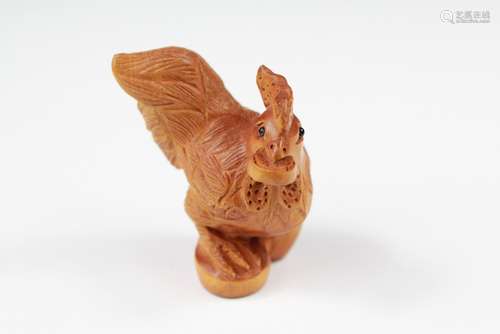 A Japanese Boxwood Netsuke, carved as a cockerel, signature to base, approx 5 cms