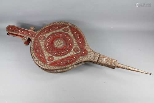 Large Middle Eastern Bellows, having copper and silver metal work, decorative carving to the front, resting on wheel feet