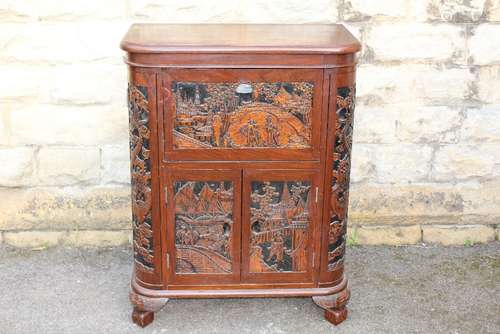 A Chinese Drinks Cabinet, complex design with intricate floral carving