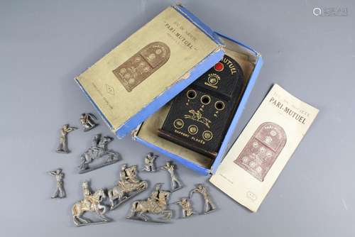 Jeu De Societe Pari-Mutuel, the game based on horse-racing contains small balls, a carpet showing ten horses, contained in the original box with instructions together with a number of lead toy soldiers infantry and mounted