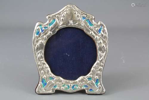 A Silver and Enamel Set Liberty-Style Easel Back Photo Frame, approx 14 x 17 cms