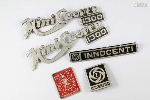 A Collection of Mini-Cooper 1300 Car Badges