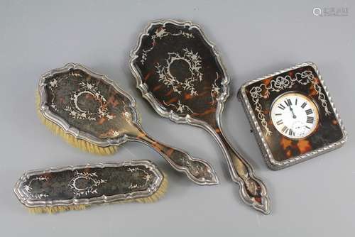 A Silver and Tortoiseshell Dressing Table Set