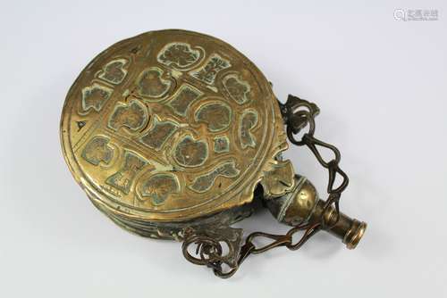 19th Century Islamic Brass Circular Powder Flask, approx 18 cms, the flask having scored foliate decoration