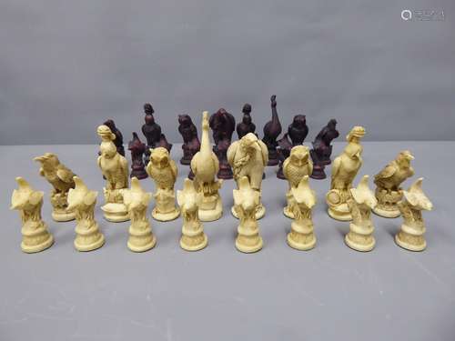 A Box containing Resin Chess Pieces