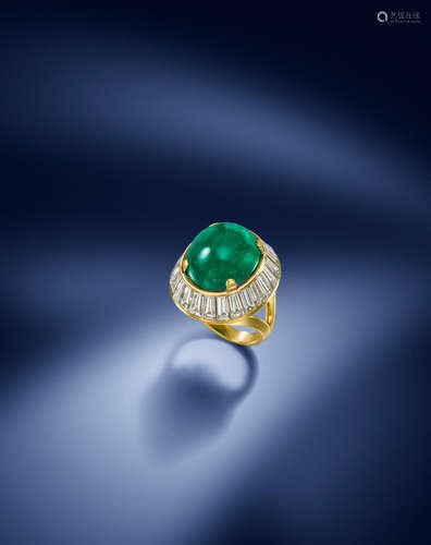 An emerald and diamond cluster ring