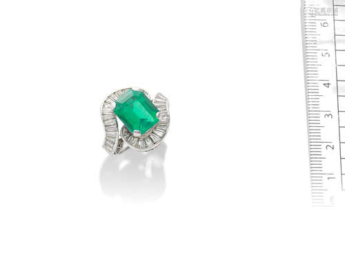 An emerald and diamond ring