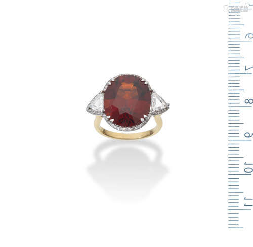 A spessartite garnet and diamond ring