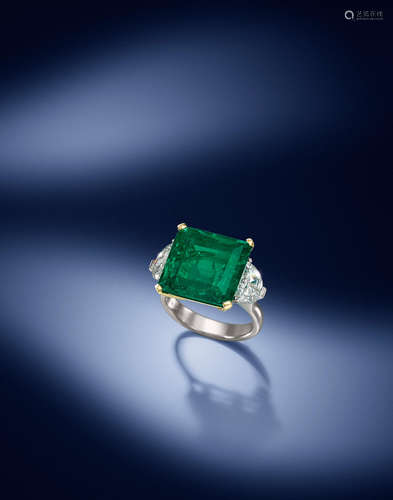 An emerald and diamond ring