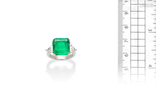 An emerald and diamond ring