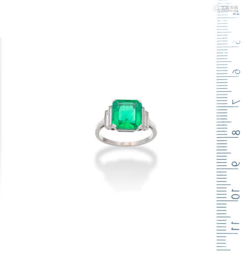 An emerald and diamond ring