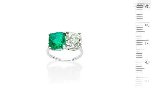 An emerald and diamond two-stone ring