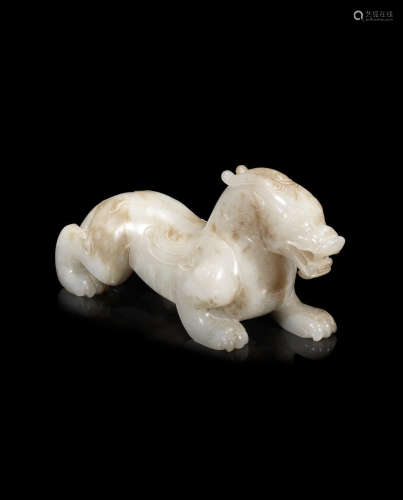 A mottled white jade Han-style carving of a bixie