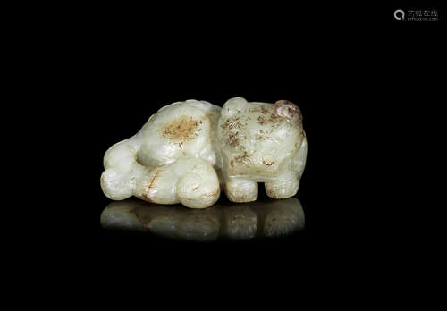 Yuan/Ming Dynasty A pale green jade carving of a recumbent lion