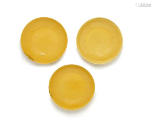 Daoguang seal marks and of the period  Three yellow-glazed saucer dishes