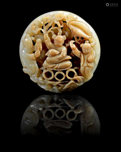 Ming Dynasty A green and russet jade reticulated circular 'boys' plaque