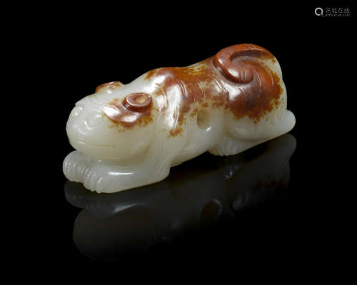 A pale green and russet jade tiger-form toggle