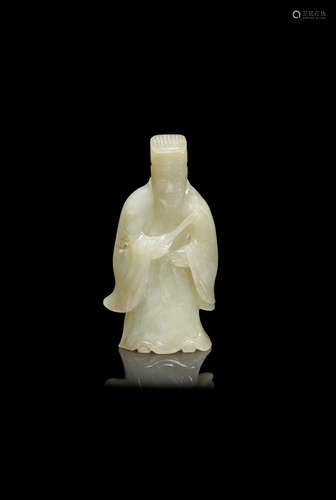 Ming Dynasty A pale green jade figure of an Immortal