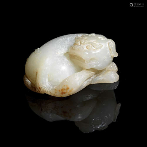Qing Dynasty A pale green jade carving of a mythical beast