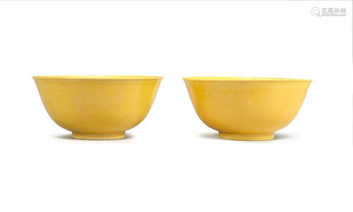 Daoguang seal marks and of the period  A pair of yellow-glazed bowls