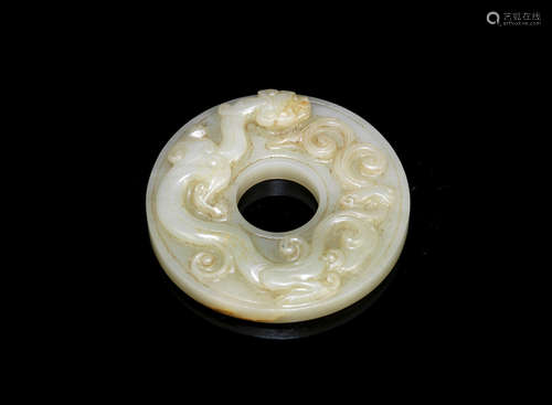 Qing Dynasty A pale green jade 'chilong' disc, bi