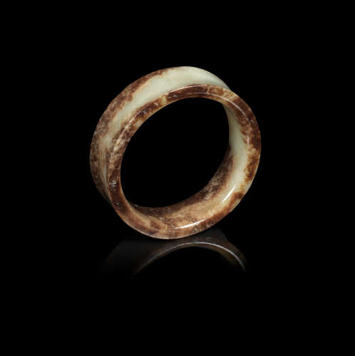 Shang Dynasty or later A yellow and russet jade bangle