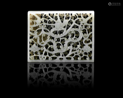 16th/17th century A pale green jade reticulated 'dragon' plaque