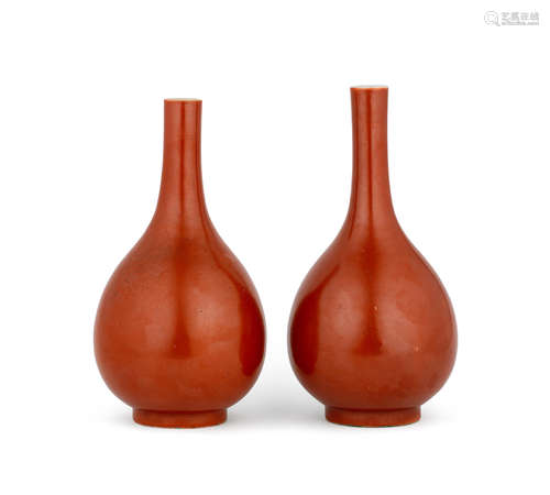 Kangxi six-character marks, late Qing Dynasty  A pair of coral-red glazed bottle vases