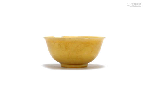 Kangxi six-character mark and of the period A yellow-glazed 'dragon' bowl