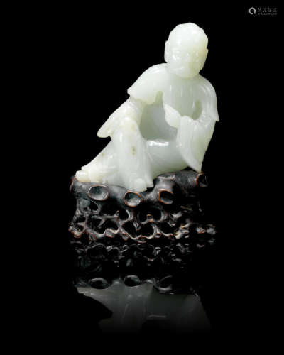 19th century A pale green jade figure of a monk