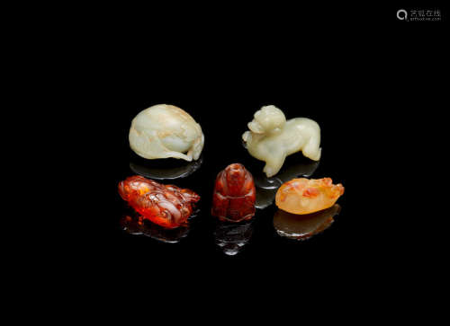 Late Ming Dynasty to 19th century A group of green jade, agate and amber carvings