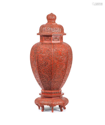 Late Qing Dynasty A carved cinnabar lacquer octagonal 'dragon' vase, cover and stand