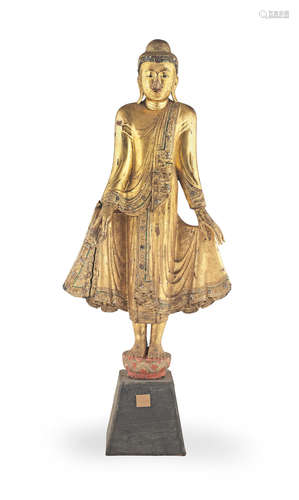 Burma, 19th/20th century A glass-inset and gilt-lacquered wood figure of Buddha