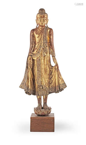 Burma, 19th/20th century A glass-inset and gilt-lacquered wood figure of Buddha