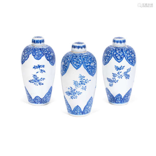 Kangxi A group of three blue and white oviform vases and covers