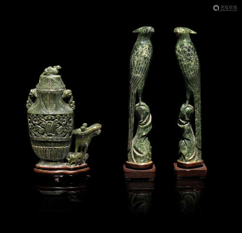 20th century  A pair of spinach green jade models of birds and a spinach green jade archaistic vase group