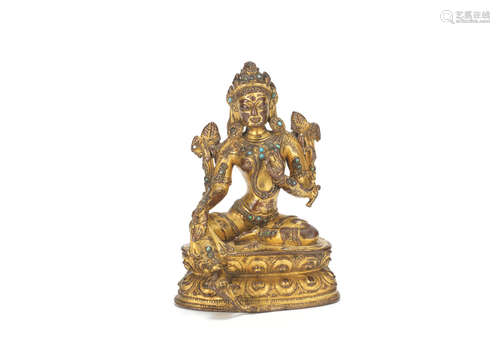 Tibet, 14th century A turquoise-inset gilt copper-alloy figure of Syamatara